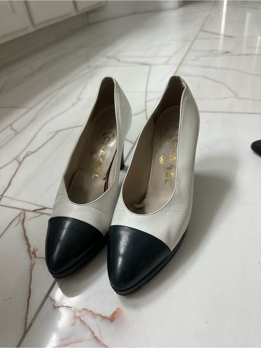 CHANEL Two-Tone Pointed Toe Pumps in White and Black